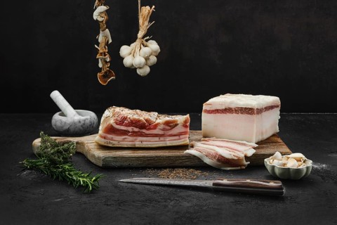Two types of salted pork belly lard on cutting board