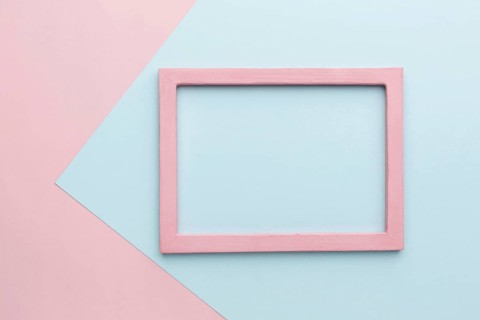 Flat lay beautiful pink wooden frame concept