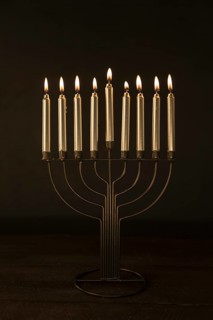 Menorah with golden burning candles