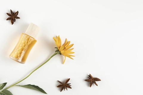 Close up view anise stars essential oil bottle