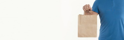 Man holding paper bag with copy space. Resolution and high quality beautiful photo