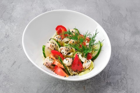 Portion of salad with ham