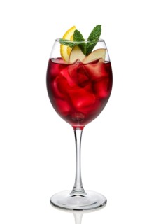 Cold sangria in a wine glass isolated on white