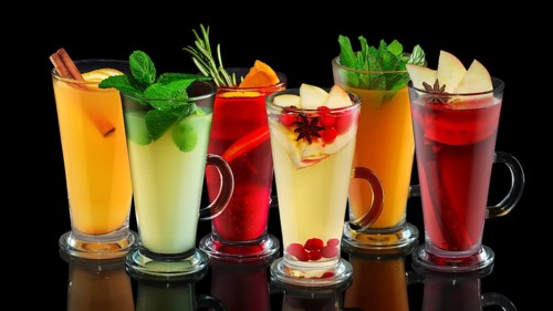 Set of tasty fruit tea in cups