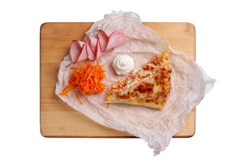 Thin pancakes stuffed with ham and spicy carrot isolated on white