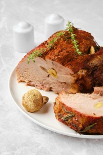 Pork neck baked in oven and cit on slice closeup