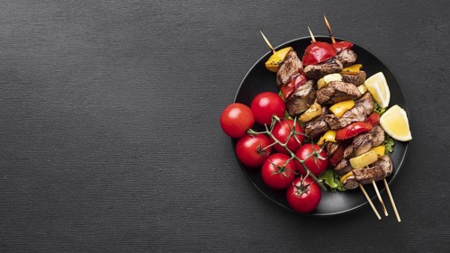 Top view delicious kebab with tomatoes copy space. Resolution and high quality beautiful photo