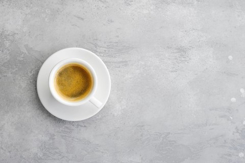 Overhead view of porcelain cup of strong coffee