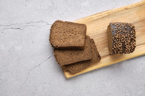 Fresh rye brown bread on wooden cutting board