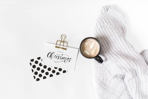 Coffee cup with christmas inscription paper