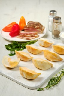 Frozen dumplings with bacon and mashed potato