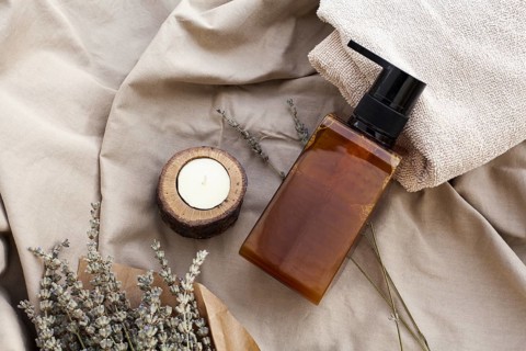 Flat lay essential oil bottle plain background
