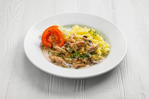 Plate with chicken goulash