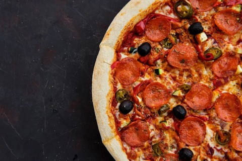 Close up view of pizza sicilian with salami