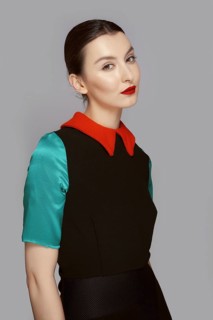 Pretty young fashion model with tan skin and red mat lips. Beauty shoot