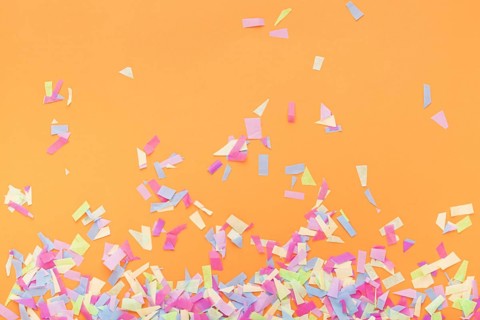 Colorful confetti orange background