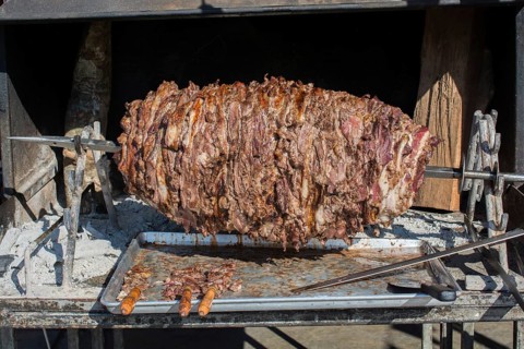 Turkish cag Kebab on pole in horizontal position