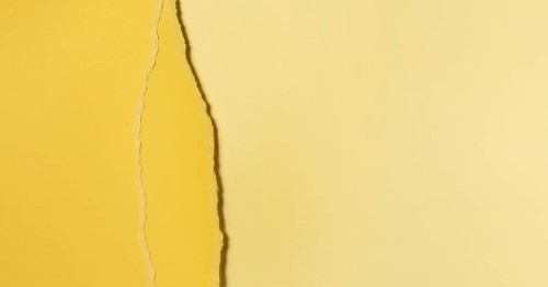 Different shades of torn yellow paper
