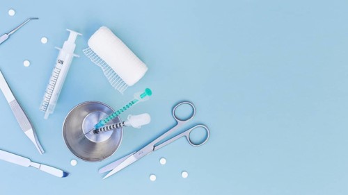 Surgical equipment s syringe glass pills gauze roll blue background. Resolution and high quality beautiful photo
