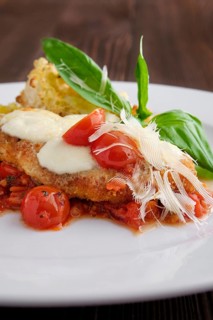 Soft focus photo of roasted chicken fillet with tomato cherry