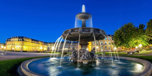 Schlossplatz with fountain and Neues Schloss travelling panorama at night in Stuttgart