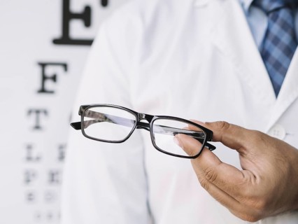 Male doctor holding pair eyeglasses his hands. Resolution and high quality beautiful photo