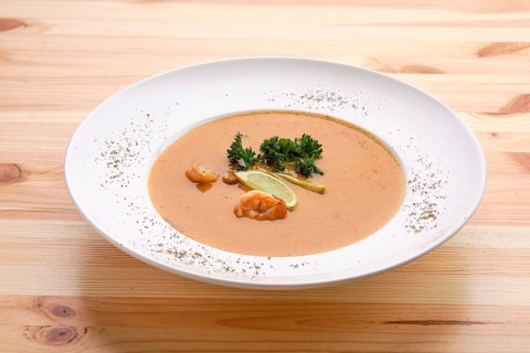 Shrimp soup on wooden table