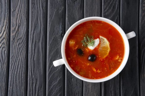 Top view of traditional rustic saltwort soup solyanka