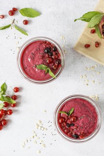Flat lay smoothie glasses with fruits