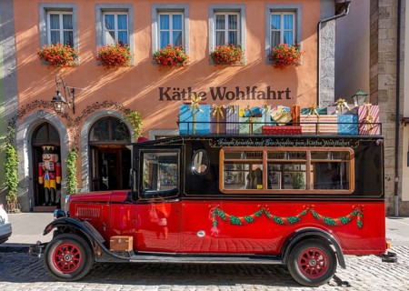 Decorated vintage bus in front of the house of Kaethe Wohlfahrt Christmas Village