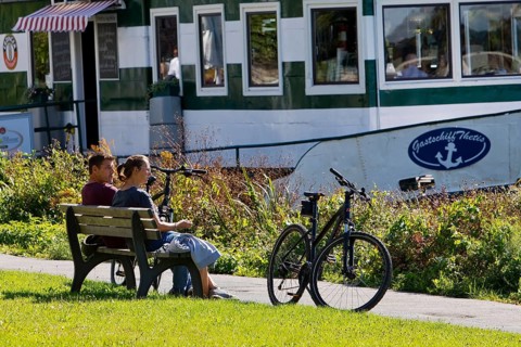 Bicycle rider at the restaurant ship Thetis