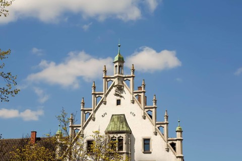 House with stone figure and turret