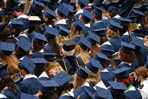 College students of George Washington University in the traditional robe and mortarboard on their graduation day