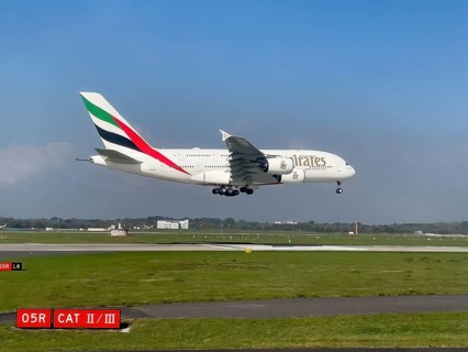Large aircraft for intercontinental flights jet passenger aircraft jet Emirates Airbus A380-800 A6-EEH on approach just in front of touch down landing touchdown on runway of Duesseldorf International ...