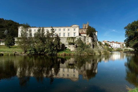 Lavoute Chilhac labelled Les Plus Beaux Villages de FrancePriory Sainte-Croix reflecting in the river Allier