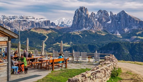 Sun terrace of the Rasciesa Hut on the Rasciesa Alp in front of the Sella Group 3152m