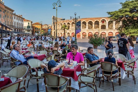 Restaurant terraces in Piazza Bra in front of the Arena di Verona