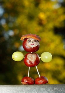 Chestnut figure with grapes in the evening light
