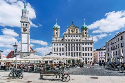 Restaurant terraces on the town hall square with Perlachturm and town hall