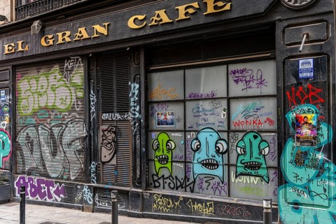 Graffiti on the blinds of vacant shops in the old town of Barcelona