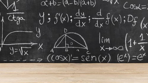 Black chalkboard with mathematical problems
