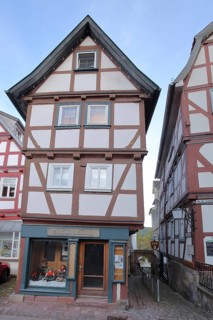 Narrow half-timbered house and bookshop