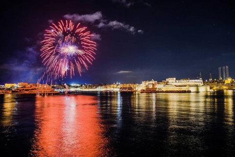 Illuminated town with fireworks