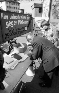 Tenants protest with a collection of signatures