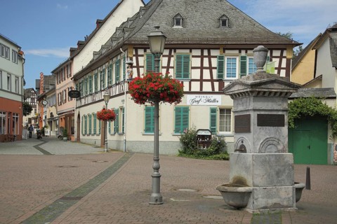 Bischof Blum Platz with Longfellow Fountain and Half-half-timbered house House Graf Mueller Winery