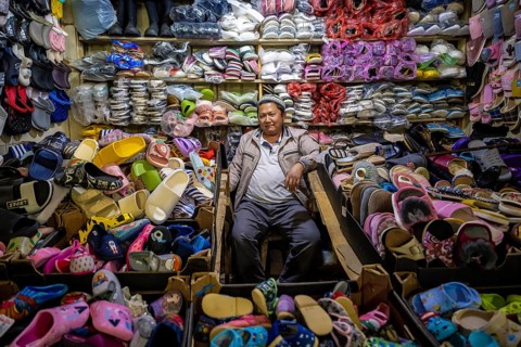 Vendor of shoes in his stall