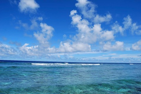 Altocumulus clouds over lagoon in Pacific Ocean