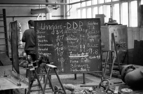 The picture was taken between 1965 and 1971 and shows a photographic impression of everyday life in this period of the GDR. Bitterfeld . Industrial complex. Football fans