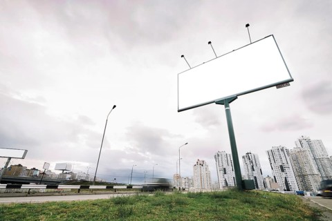 Billboard city entrance cloudy day