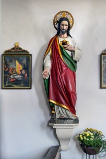 Christ figure with floral decoration